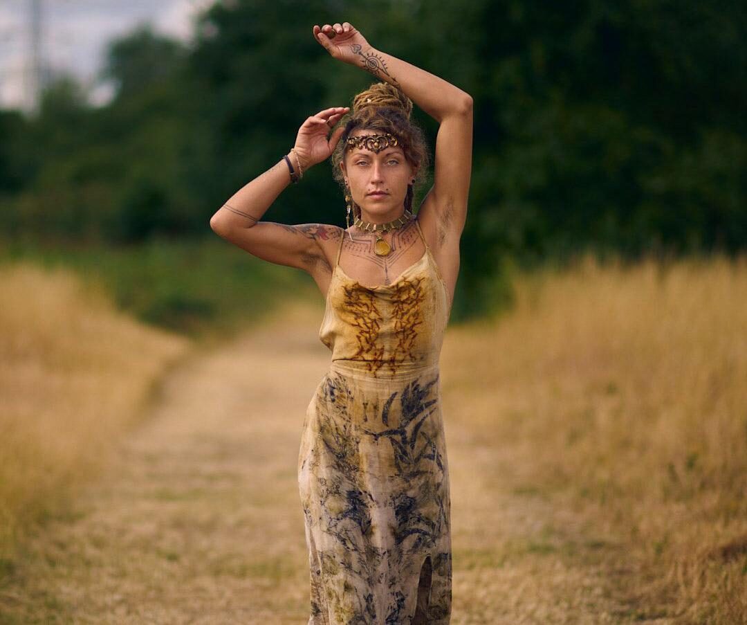 model in ecoprinted dress in golden field